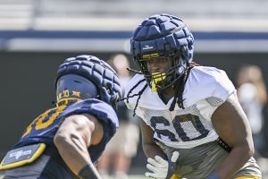WVU is cross-training linemen this spring to improve depth, football IQ